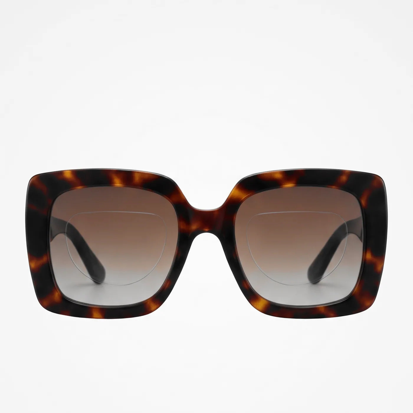 Tortoise sunglasses from the front, the patches a faint outline
