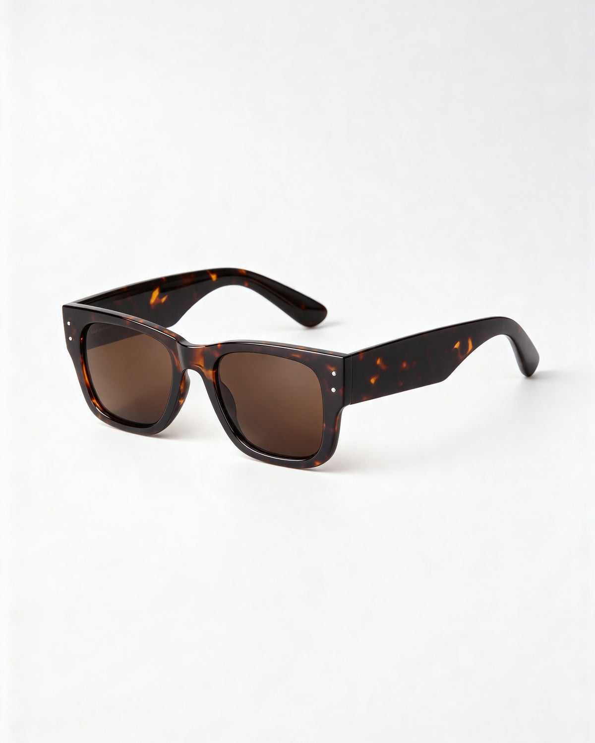 Thick tortoiseshell square sunglasses with brown lenses, three quarter view