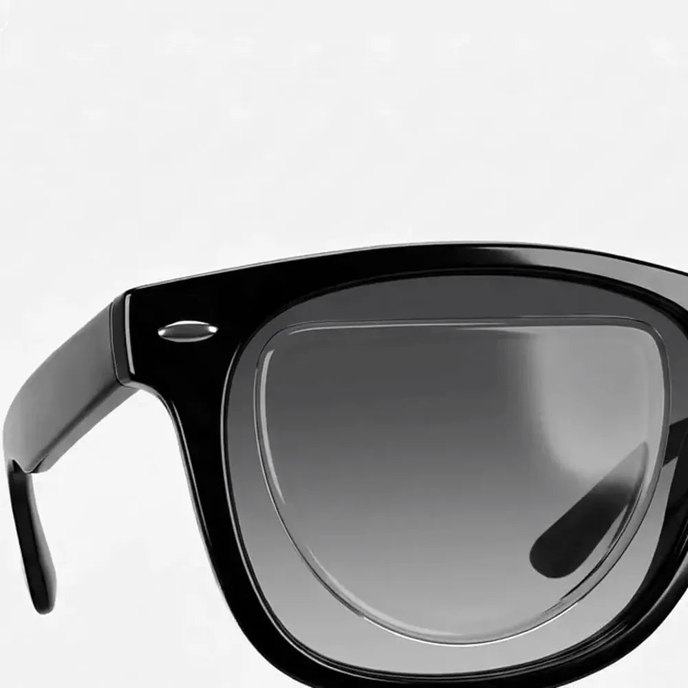 The patch pressed inside a black sunglass lens, straight edge up