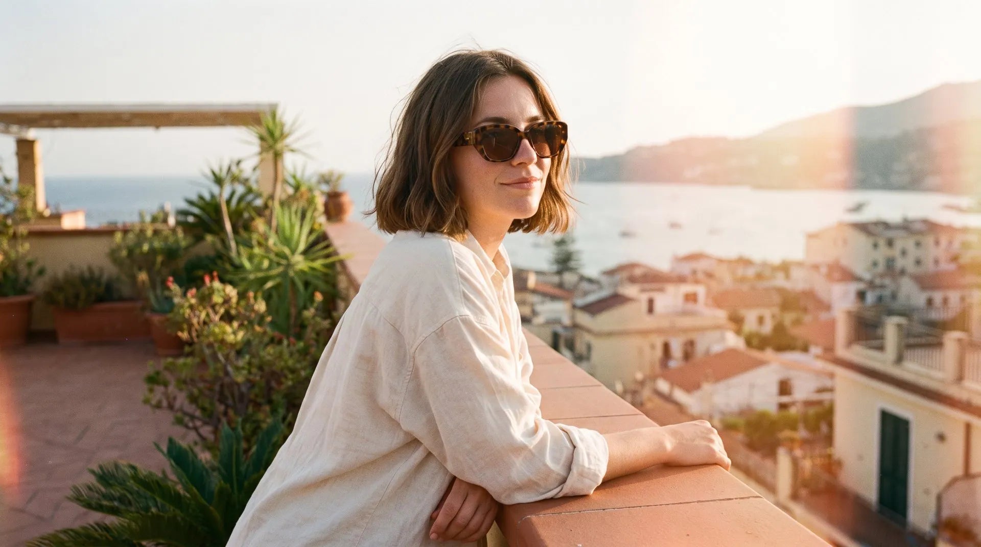 A woman in sunglasses at golden hour